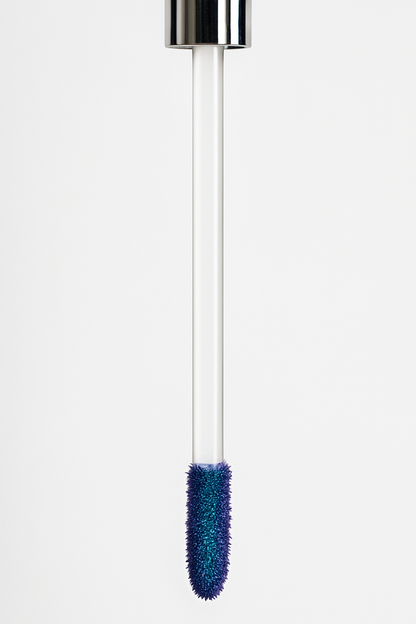 Close-up of doe-foot applicator coated in blue peel-off lip stain — Ocean Avenue Beauty.