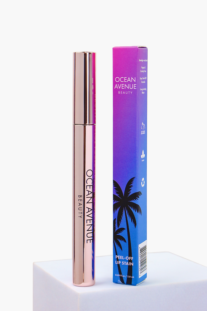 Vintage Flamingo peel-off lip stain—tube and retail box on a pedestal, Ocean Avenue Beauty.